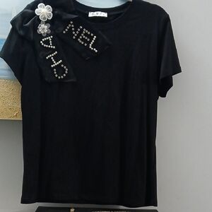Chic Black Top with Embellished Detail